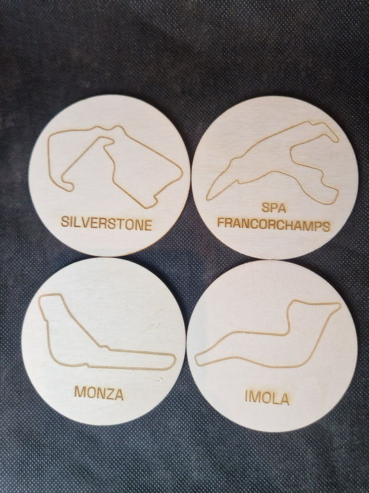 Wooden coaster set with laser cut race track designs
