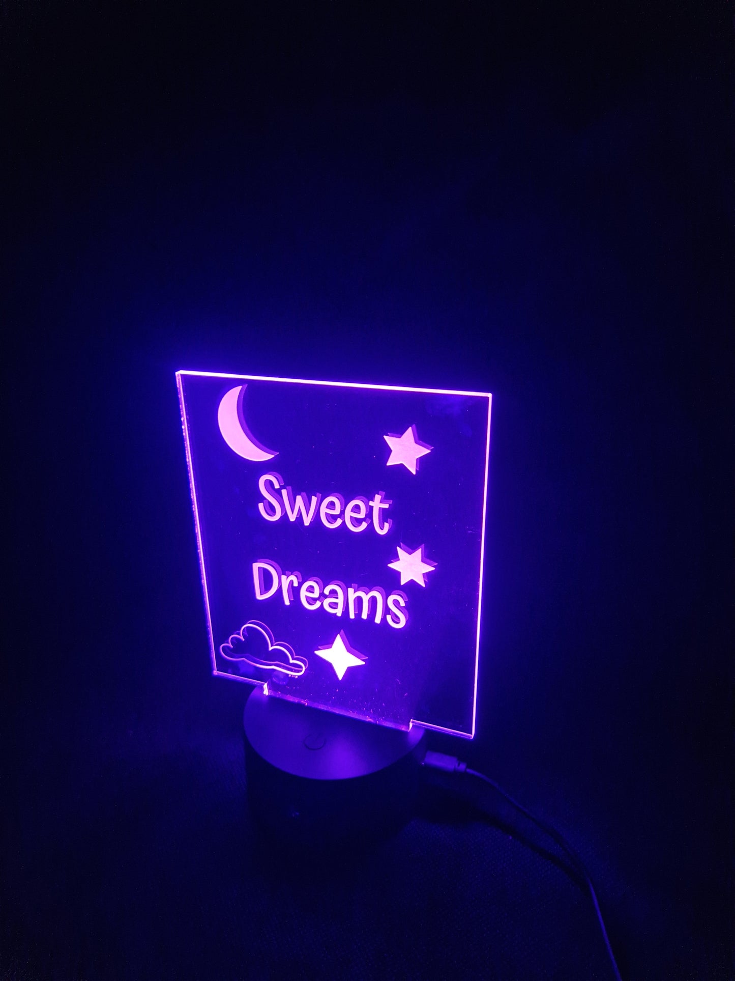 LED illuminated acrylic sign with custom laser engraved text and color-changing base