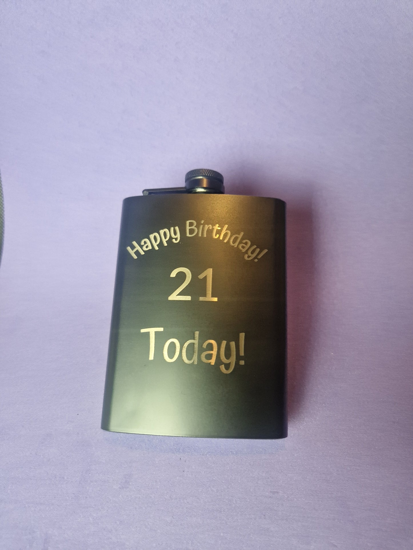 Stainless steel hip flask with personalized laser engraved message and brushed metal finish