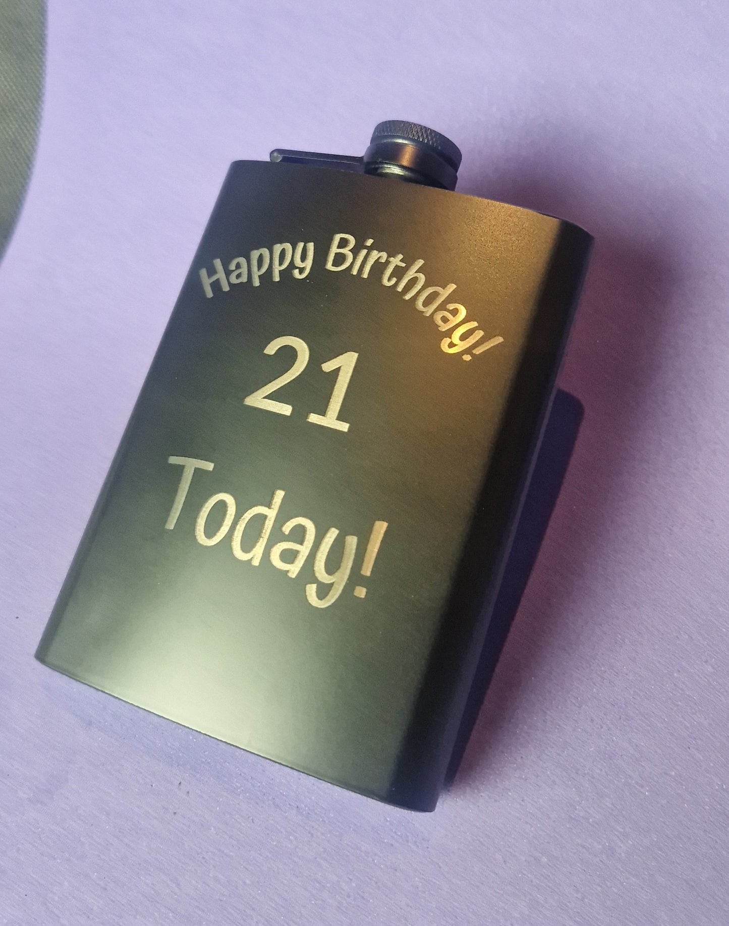 Stainless steel hip flask with personalized laser engraved message and brushed metal finish