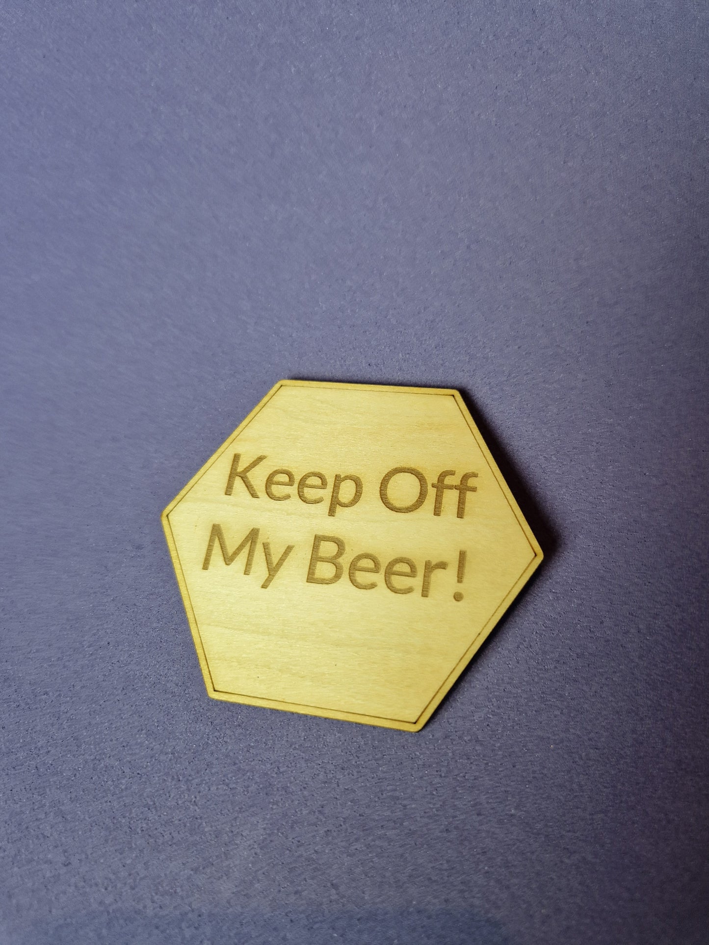 Custom wooden fridge magnet with laser engraved design and magnetic backing