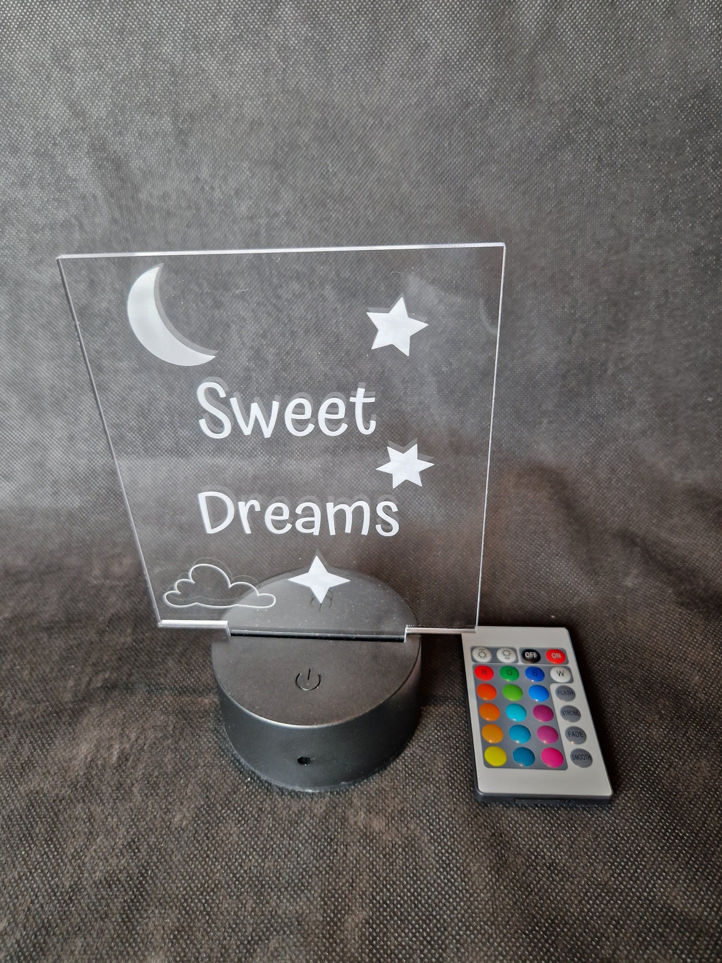 LED illuminated acrylic sign with custom laser engraved text and color-changing base