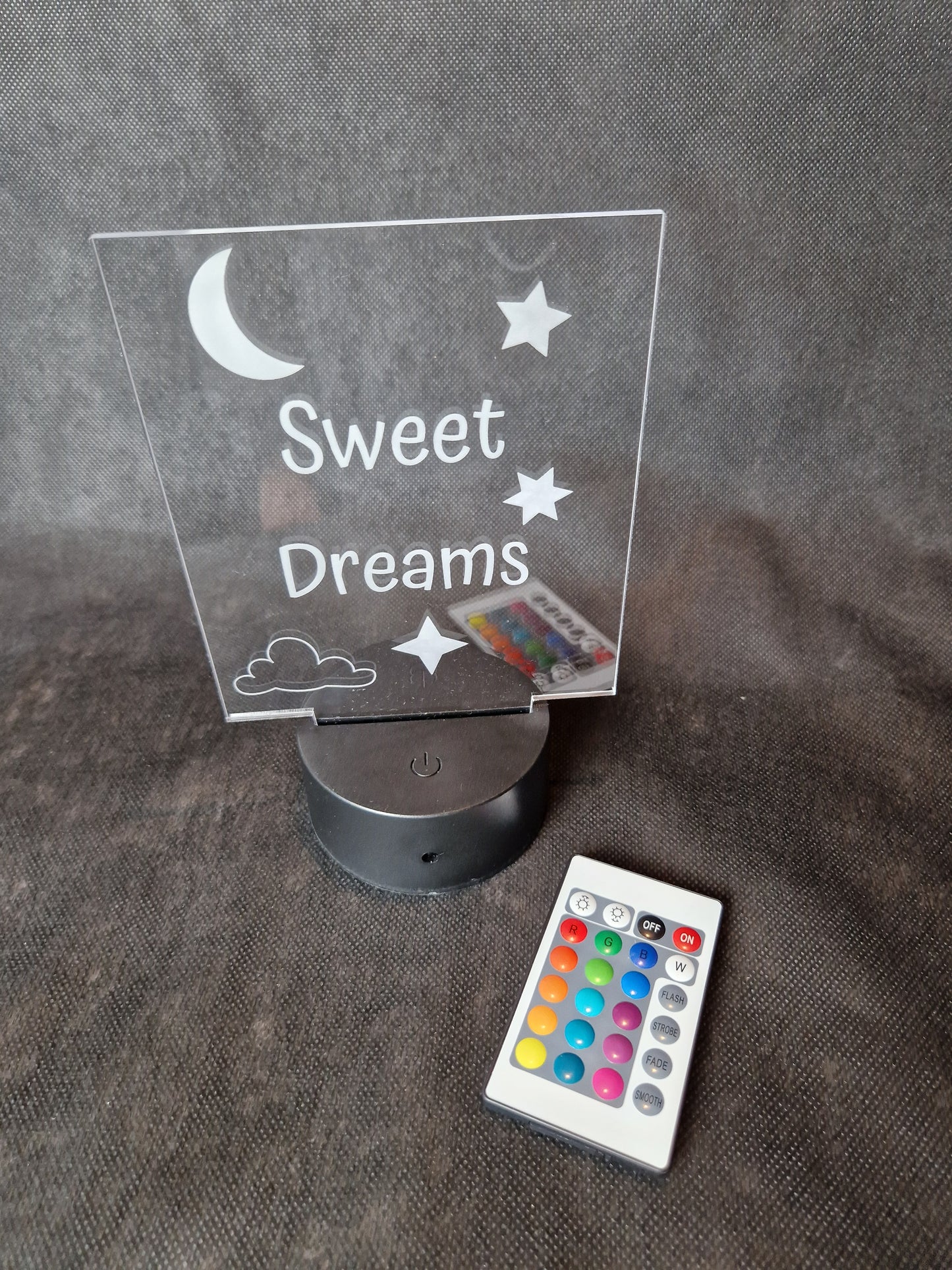 LED illuminated acrylic sign with custom laser engraved text and color-changing base