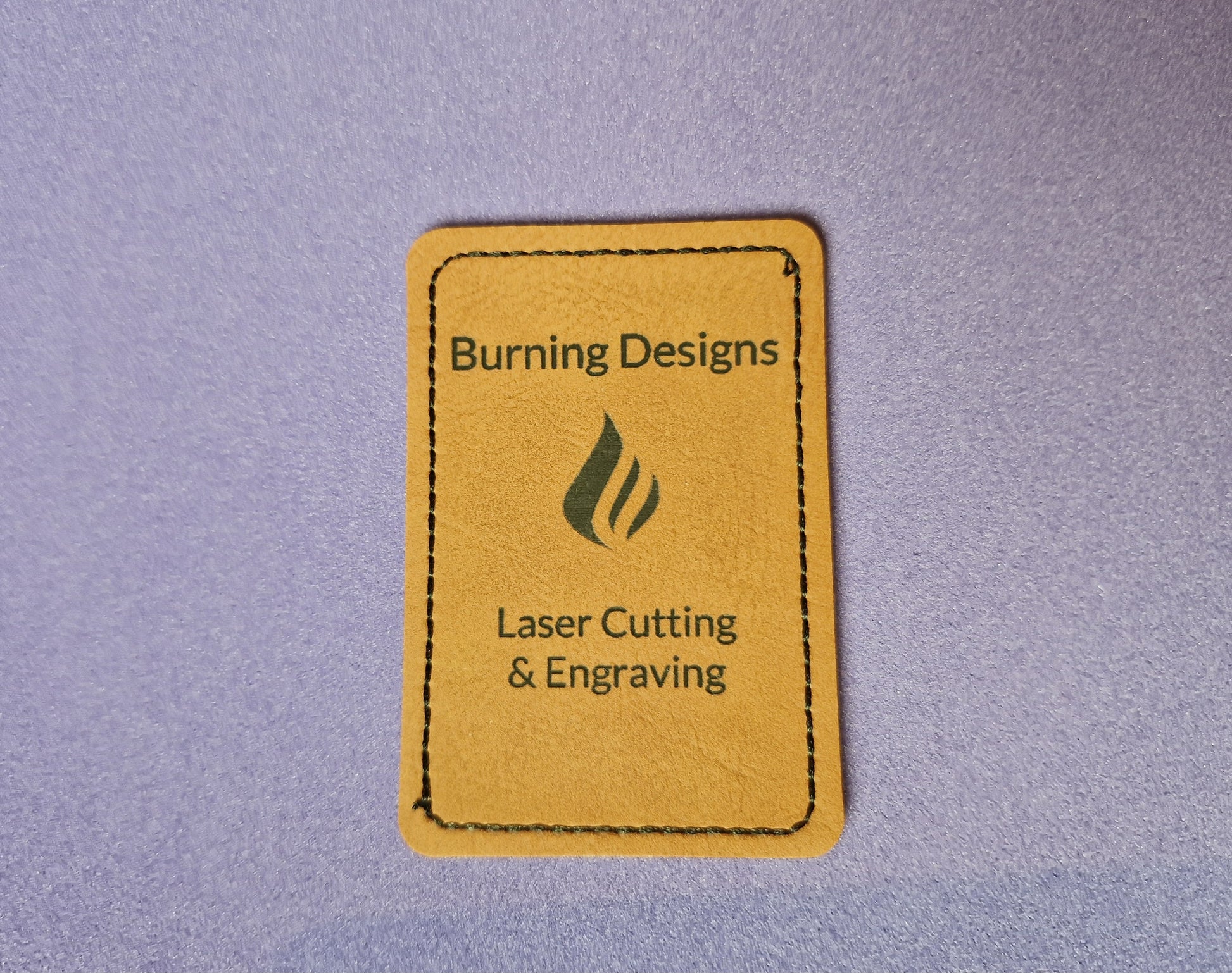 Custom faux leather patches with laser engraved design and adhesive backing