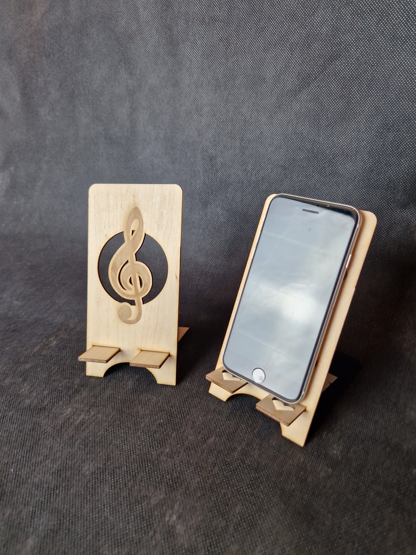 Wooden phone stand with laser cut design and stable base for desk organization