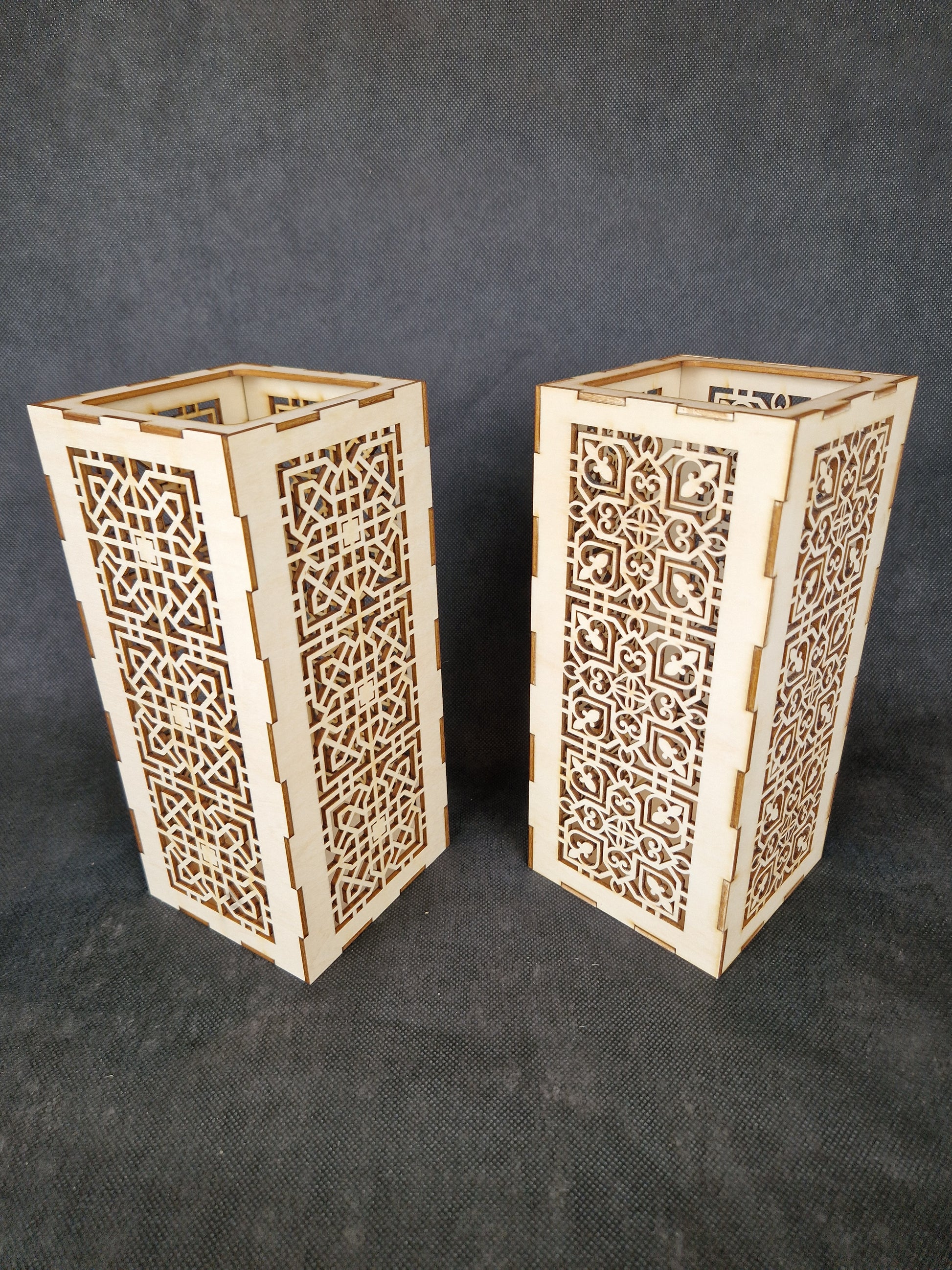 Decorative wooden lantern with intricate laser cut patterns and tea light holder