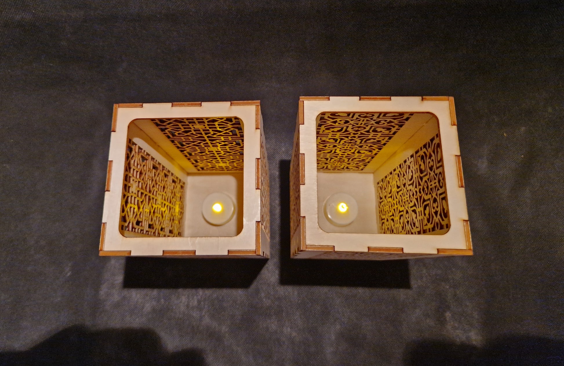Decorative wooden lantern with intricate laser cut patterns and tea light holder