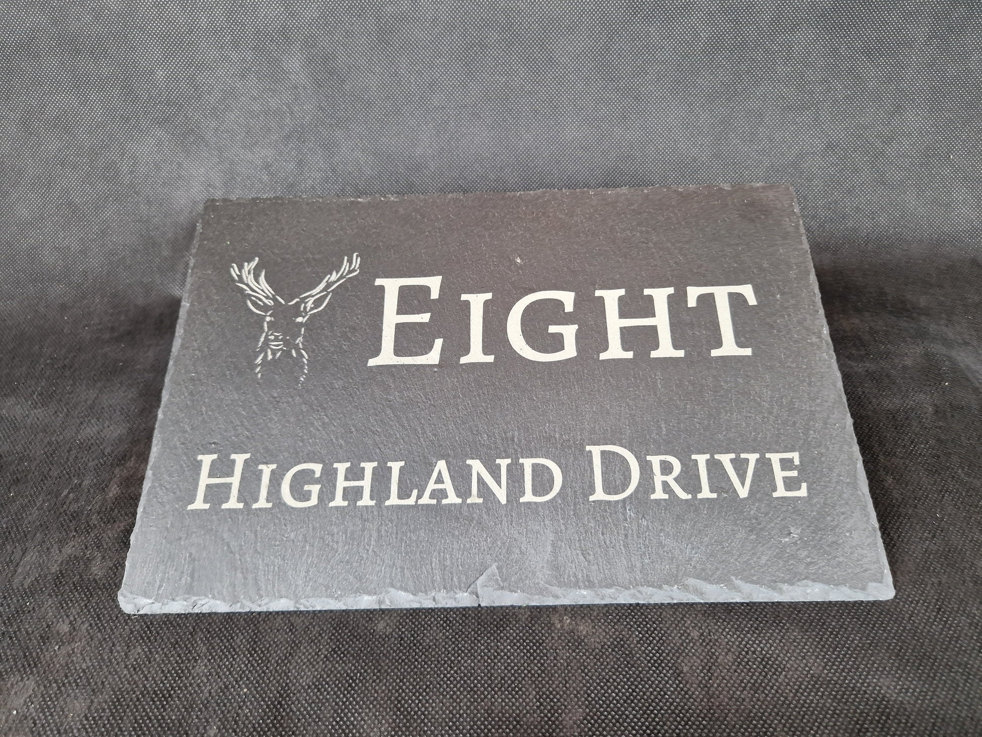 Black slate A4 house sign with custom laser engraved family name and house number