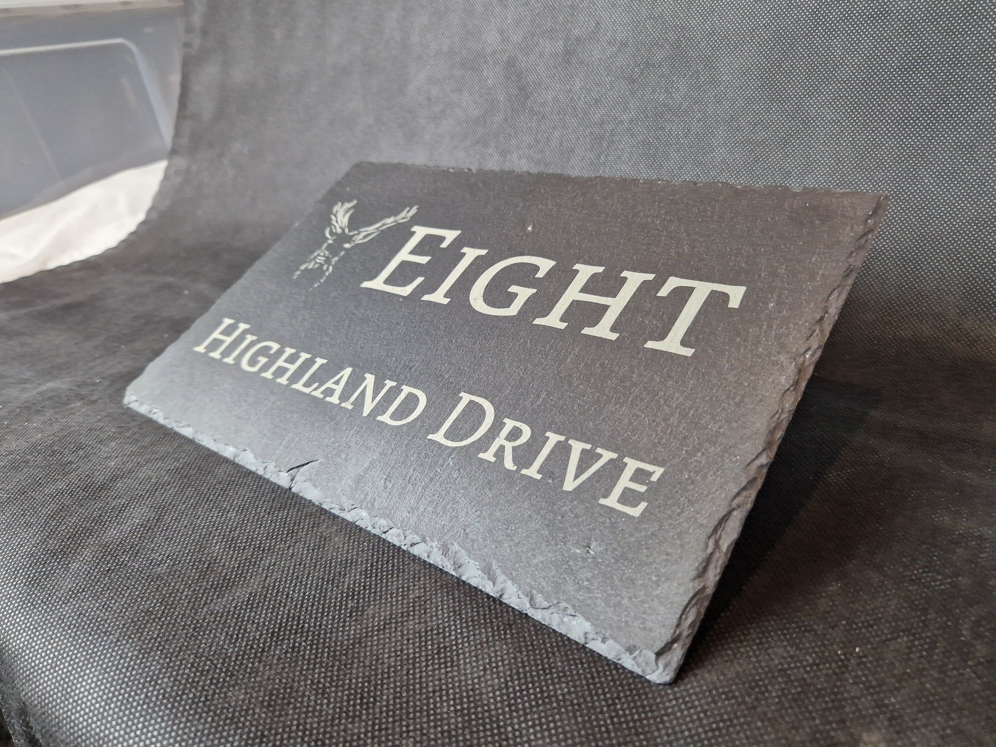 Black slate A4 house sign with custom laser engraved family name and house number