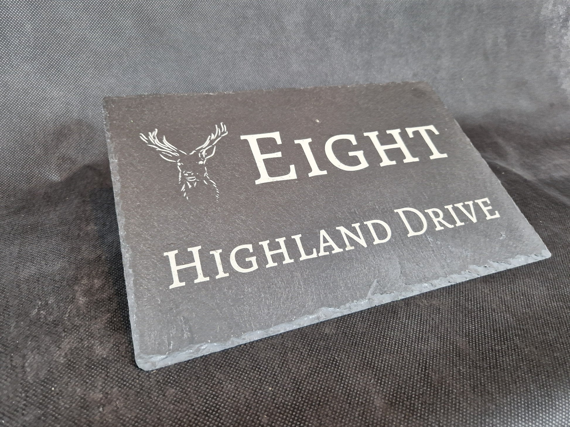 Black slate A4 house sign with custom laser engraved family name and house number
