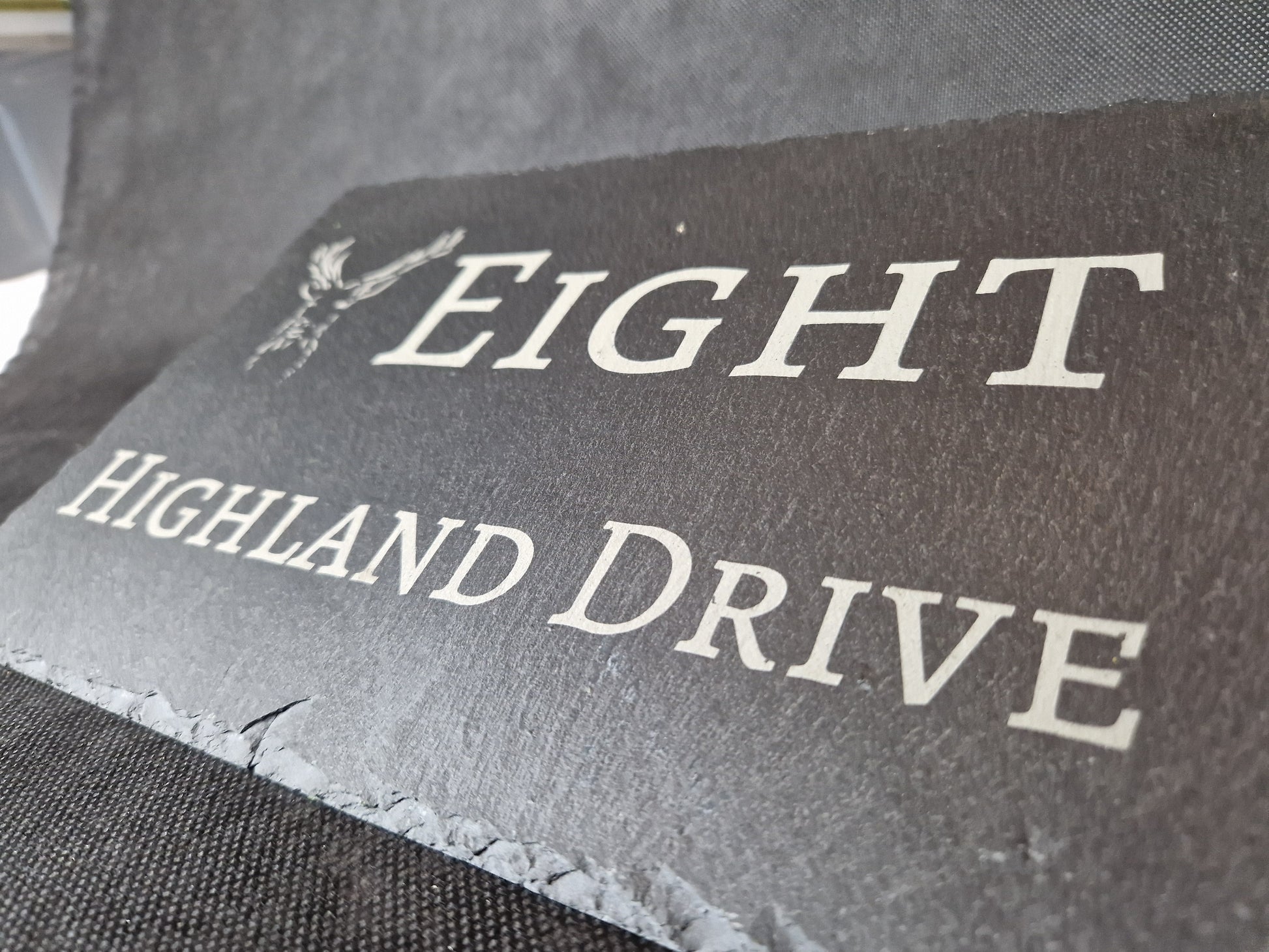 Black slate A4 house sign with custom laser engraved family name and house number