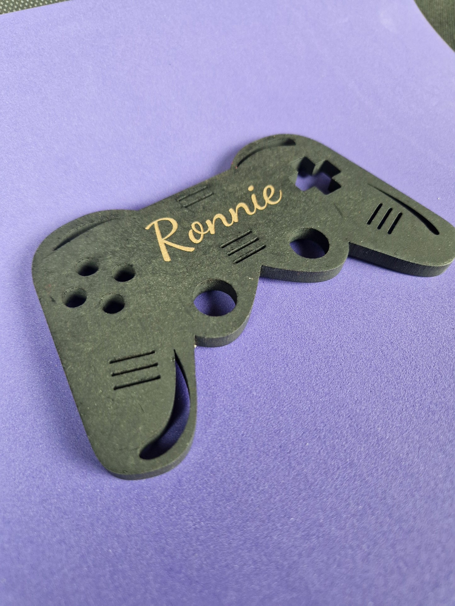Custom wooden game controller stand with personalized laser engraved gamer design