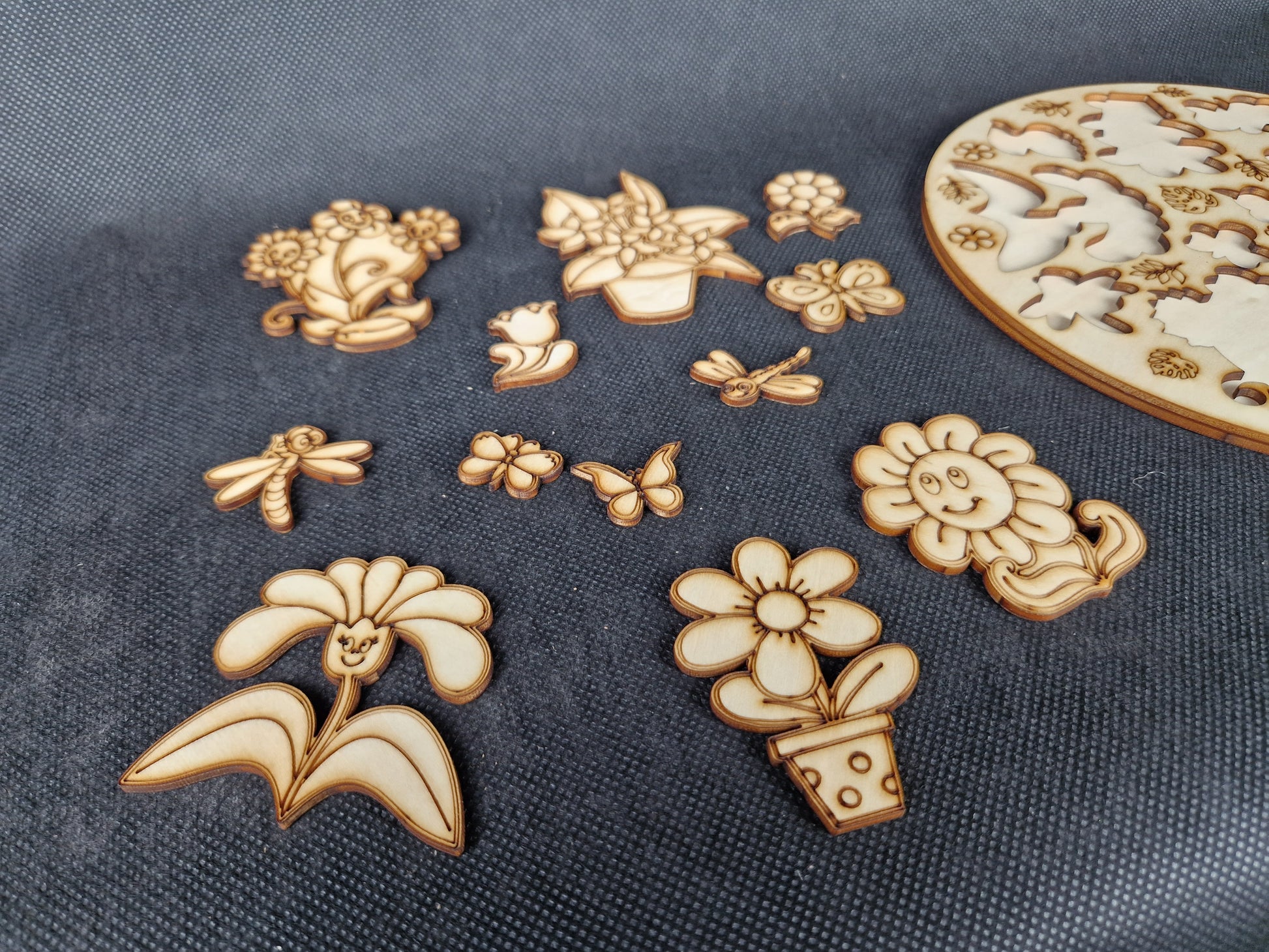 Wooden children's shape sorter puzzle laser cut and scored cartoon plant and butterfly design