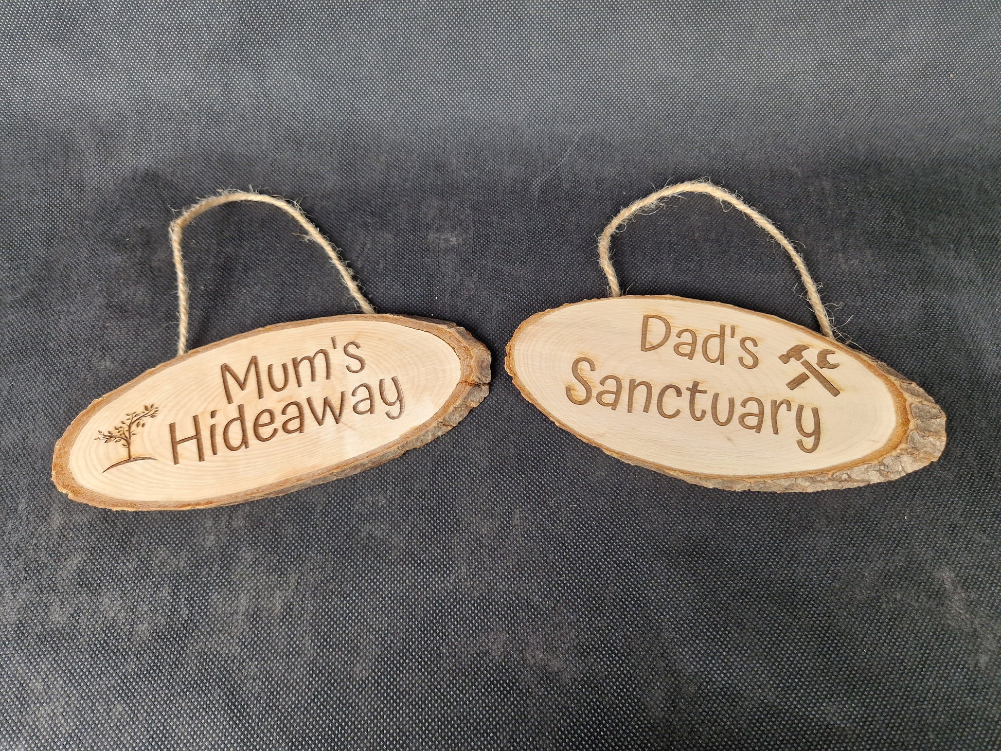 Natural wood slice hanging sign with rustic laser engraved text and jute rope hanger