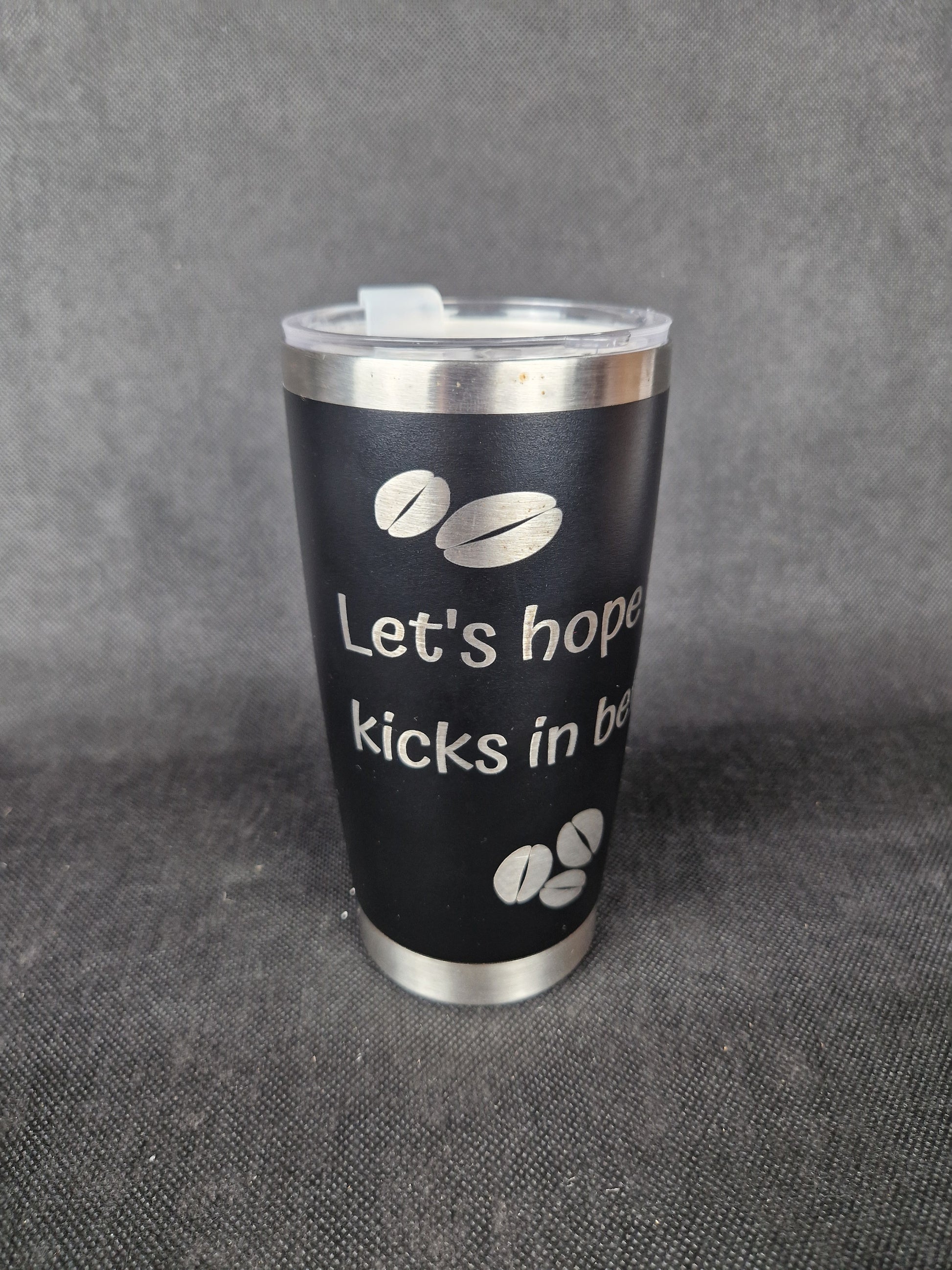 Stainless steel travel tumbler with custom laser engraved design and insulated walls