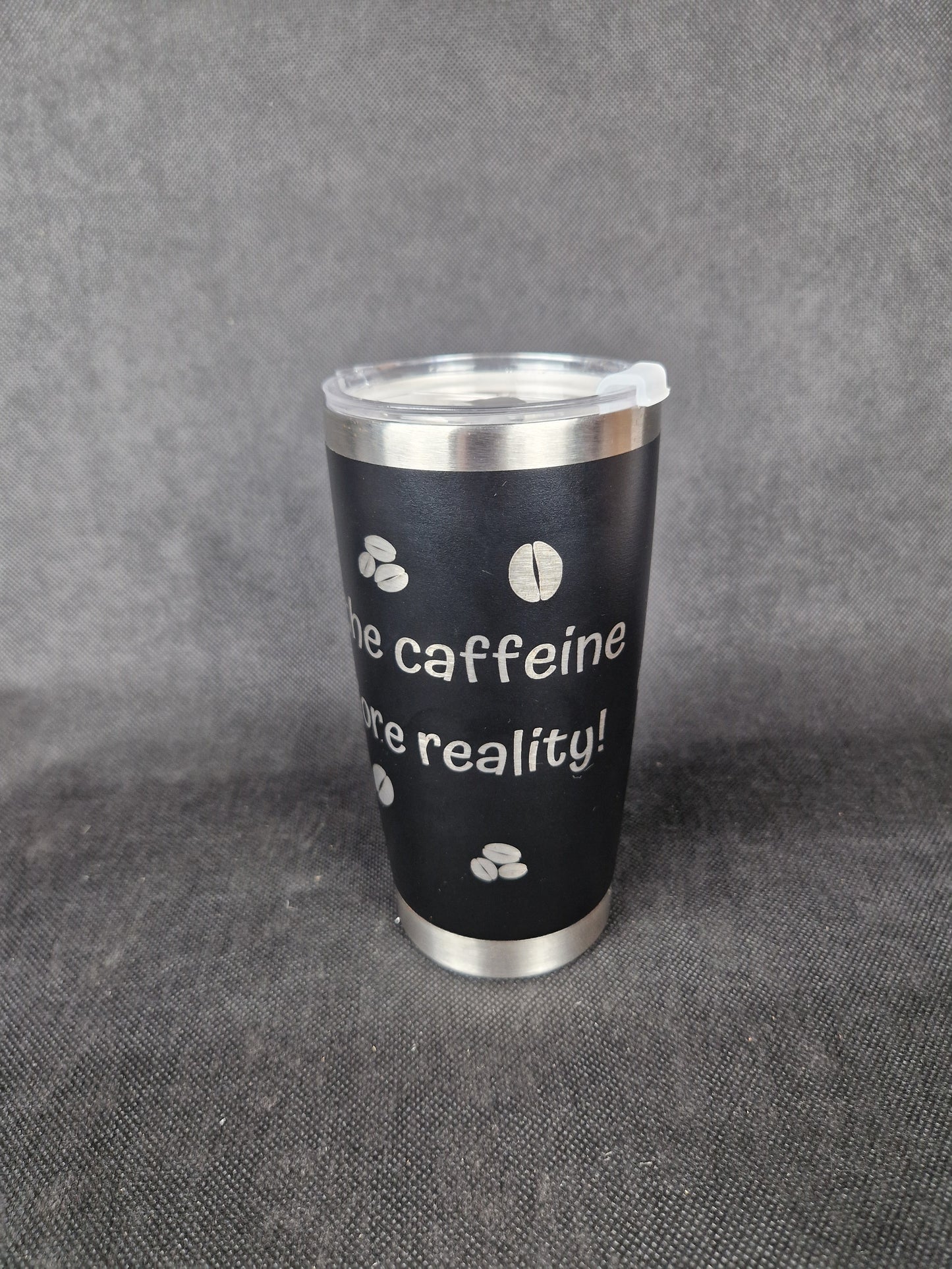 Stainless steel travel tumbler with custom laser engraved design and insulated walls