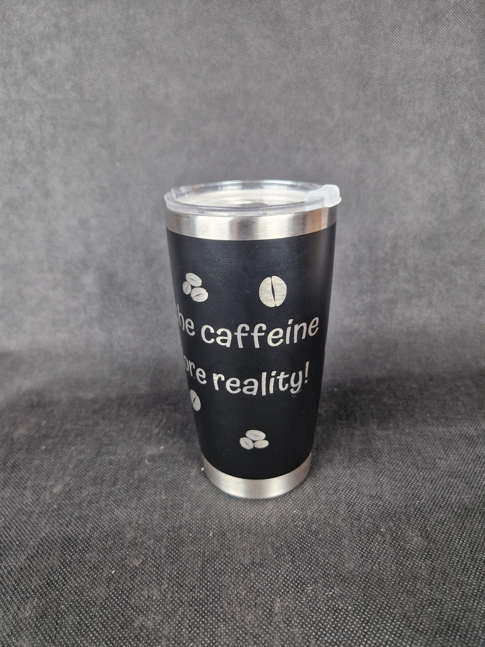 Stainless steel travel tumbler with custom laser engraved design and insulated walls