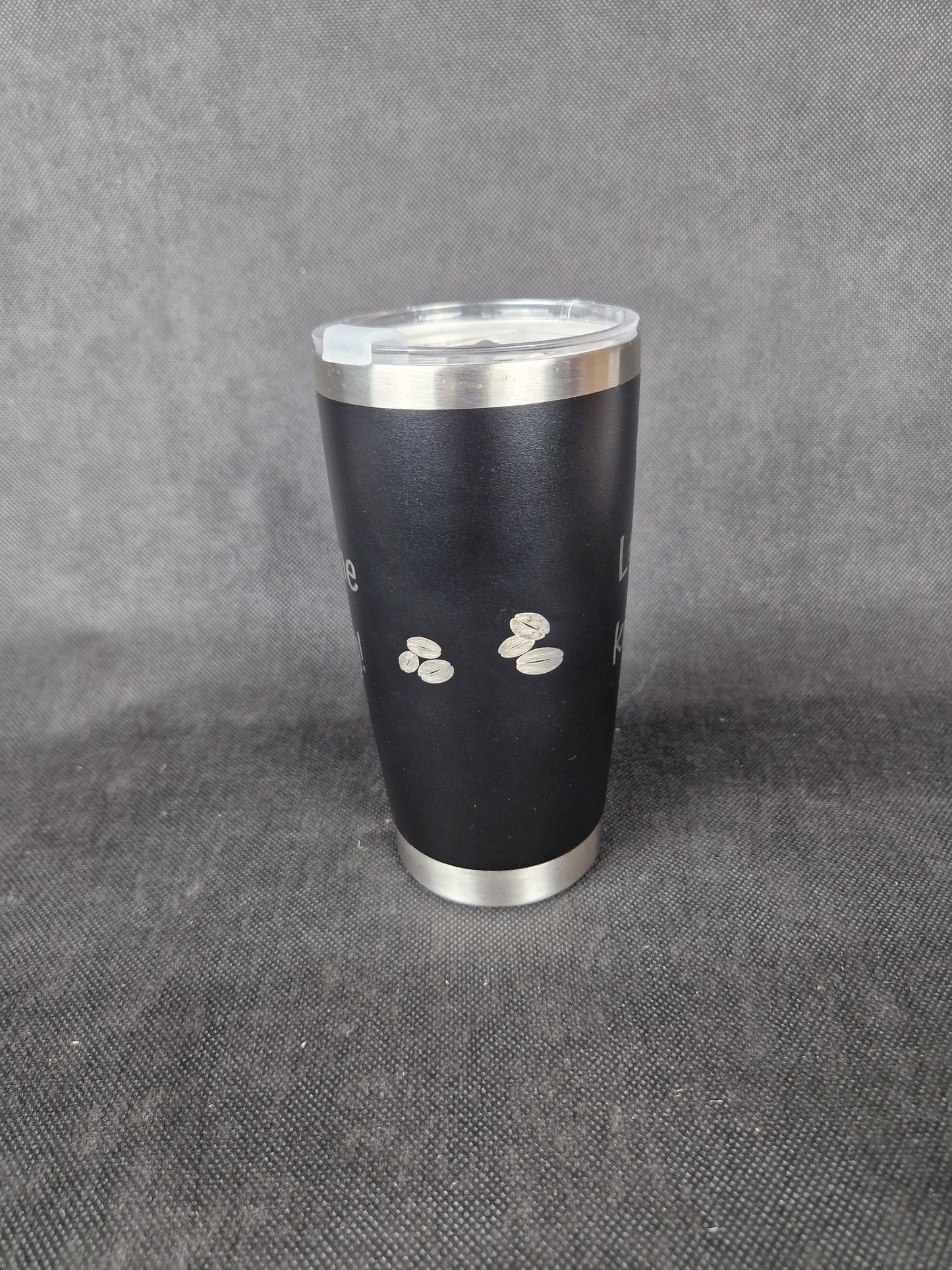 Stainless steel travel tumbler with custom laser engraved design and insulated walls