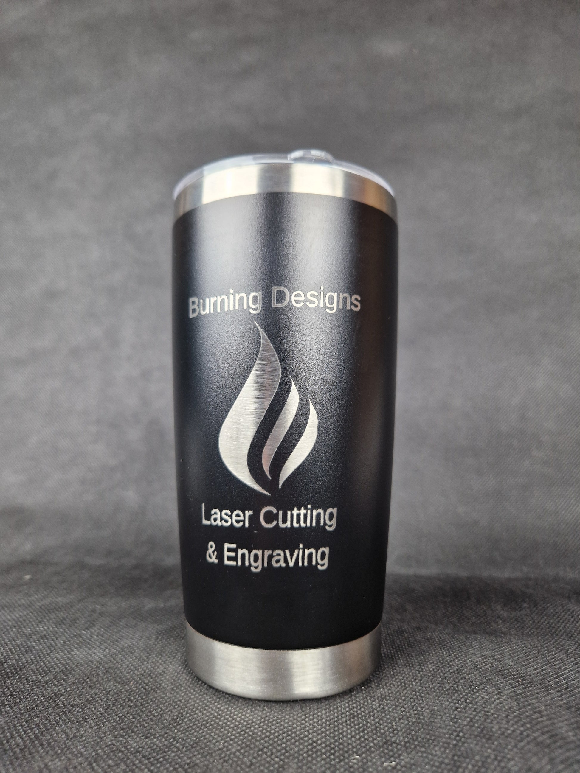 Stainless steel travel tumbler with custom laser engraved design and insulated walls