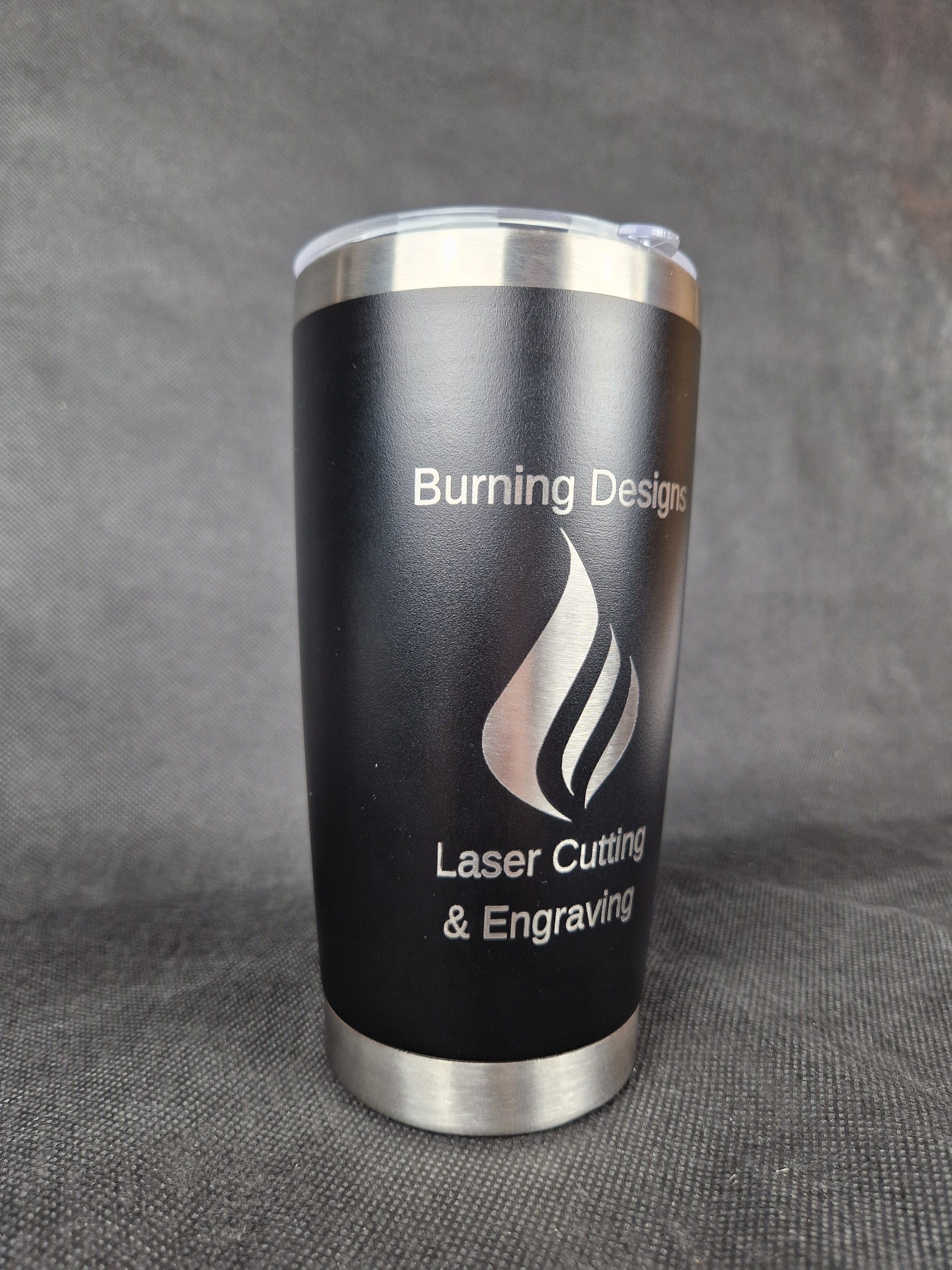 Stainless steel travel tumbler with custom laser engraved design and insulated walls