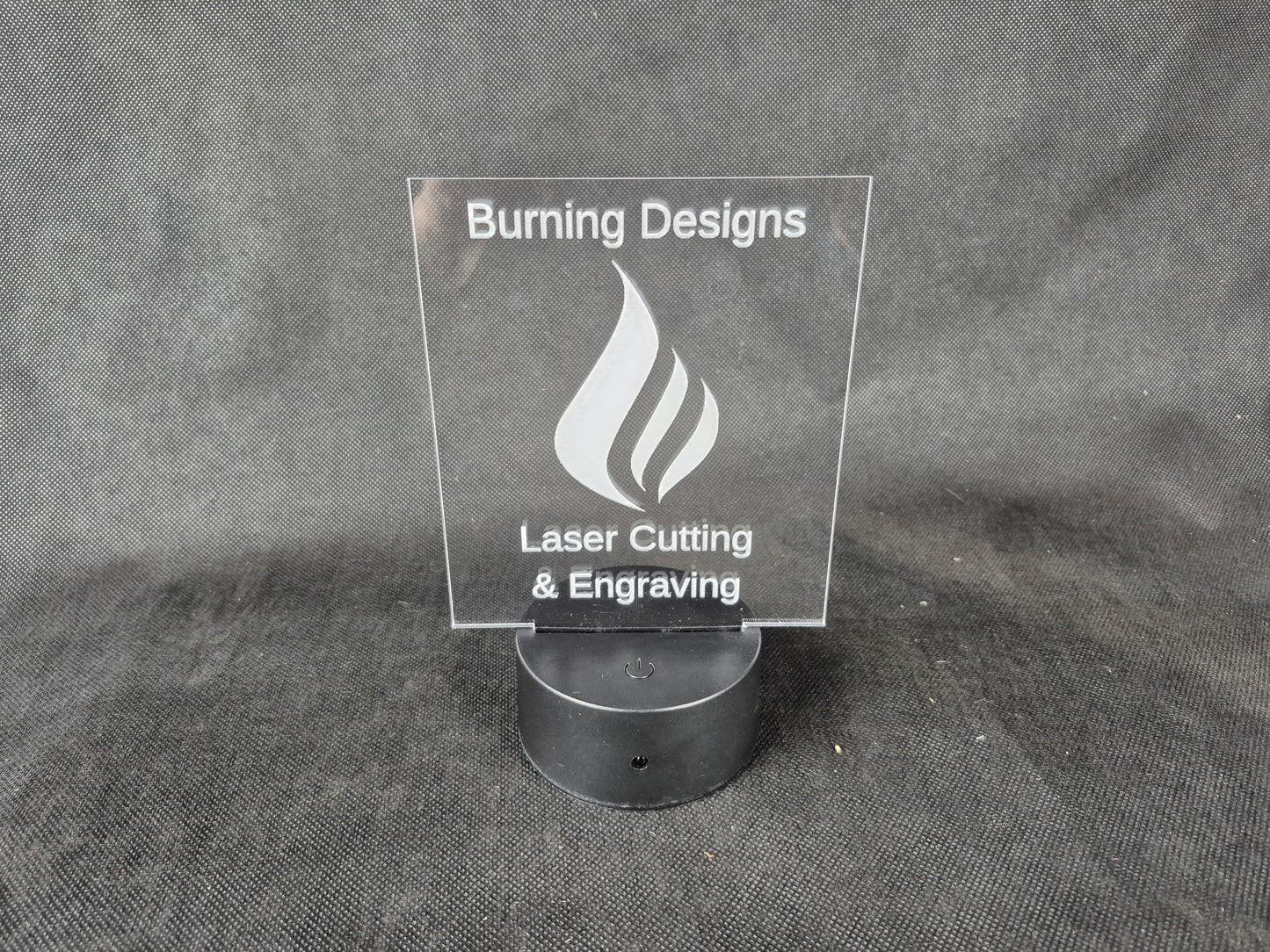 LED illuminated acrylic sign with custom laser engraved text and color-changing base