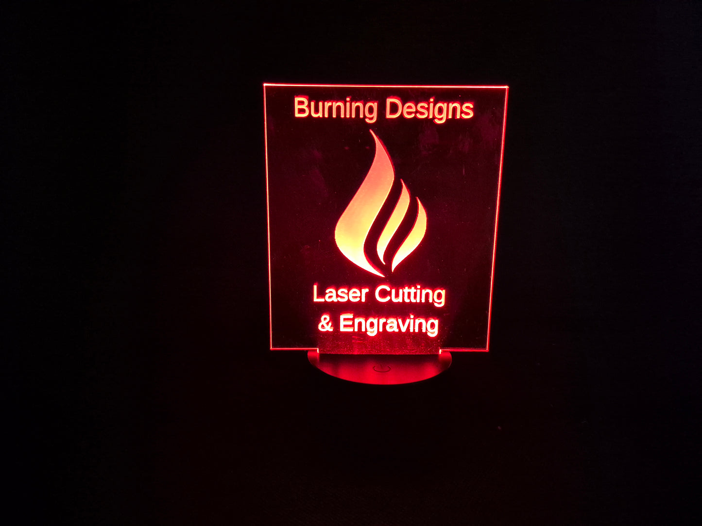 LED illuminated acrylic sign with custom laser engraved text and color-changing base