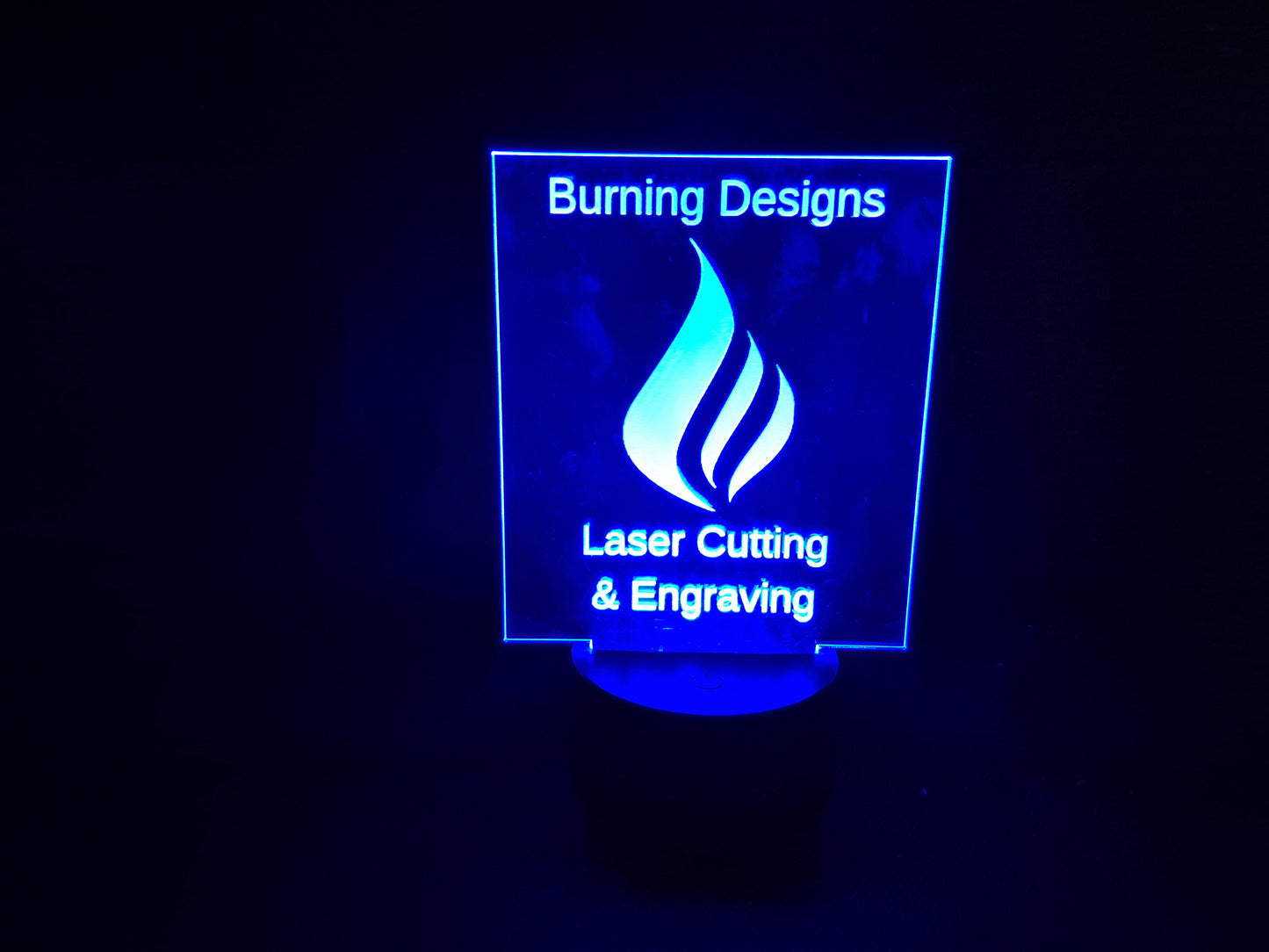 LED illuminated acrylic sign with custom laser engraved text and color-changing base