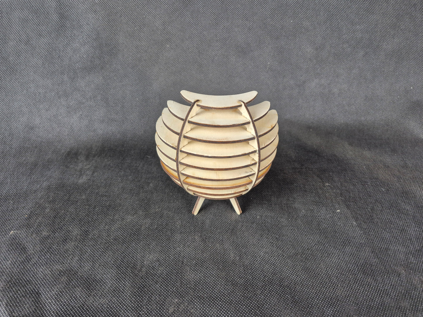 Spherical geometric tea light holder with intricate laser cut design and shadow effects