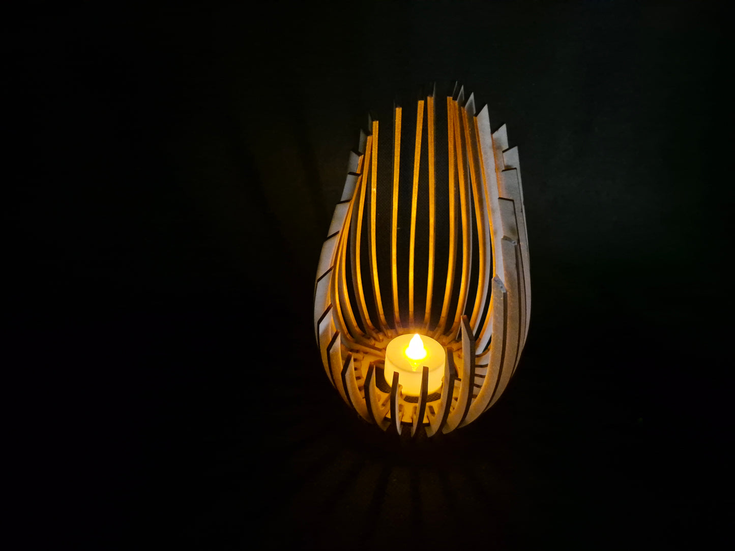 Modern wooden tea light holder with laser cut droplet geometric pattern design