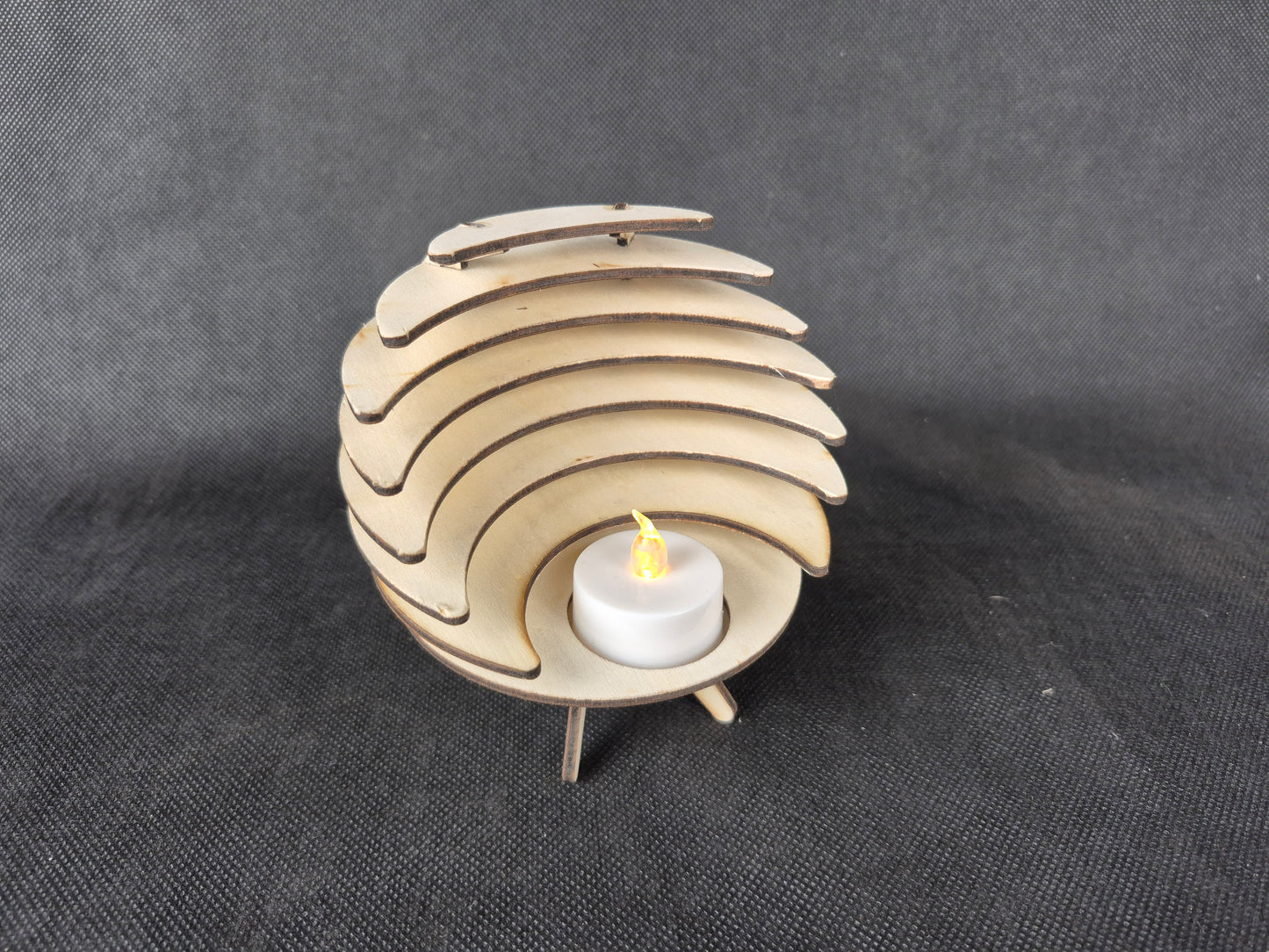 Spherical geometric tea light holder with intricate laser cut design and shadow effects