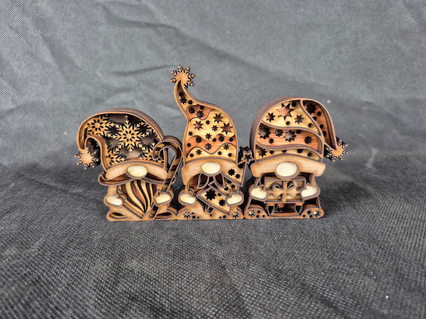 Three-dimensional wooden Nordic Gnome with layered laser cut design and festive details