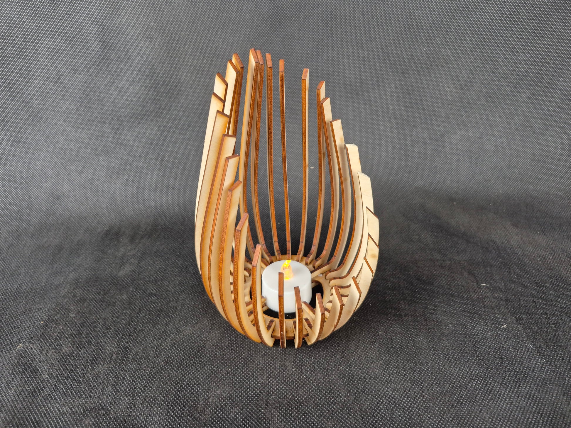 Modern wooden tea light holder with laser cut droplet geometric pattern design