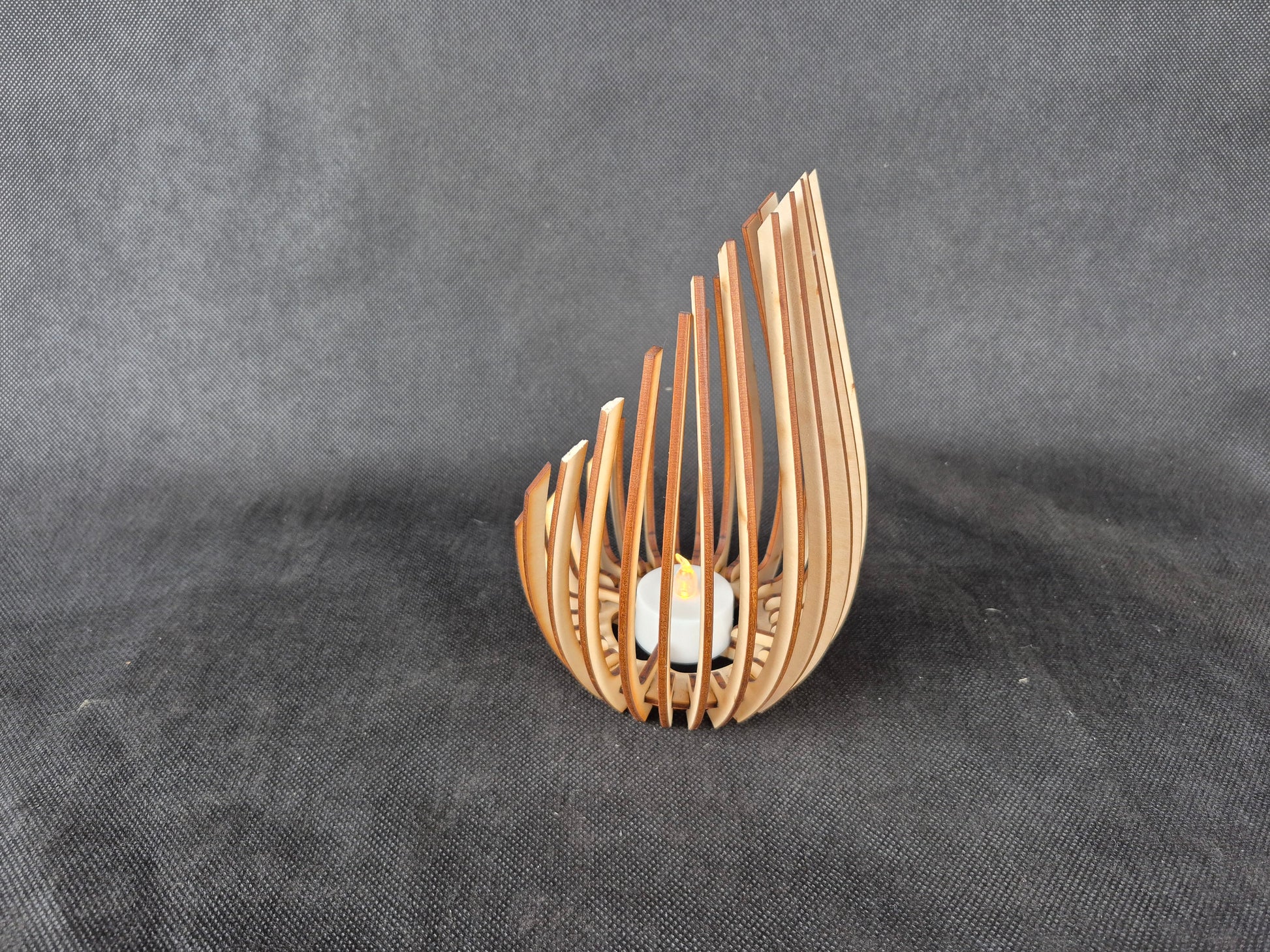 Modern wooden tea light holder with laser cut droplet geometric pattern design
