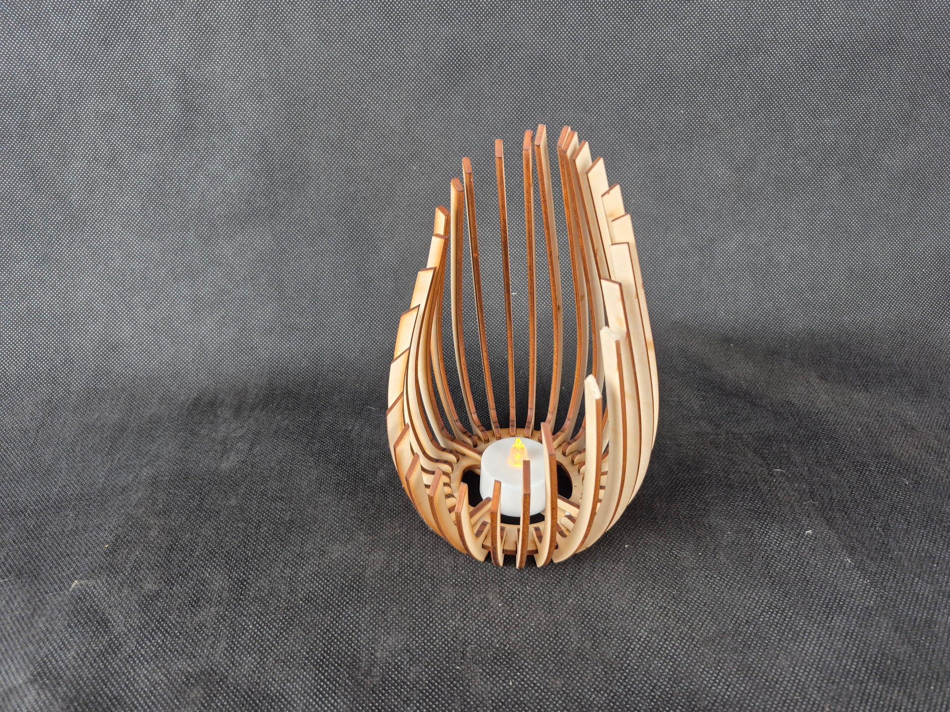 Modern wooden tea light holder with laser cut droplet geometric pattern design