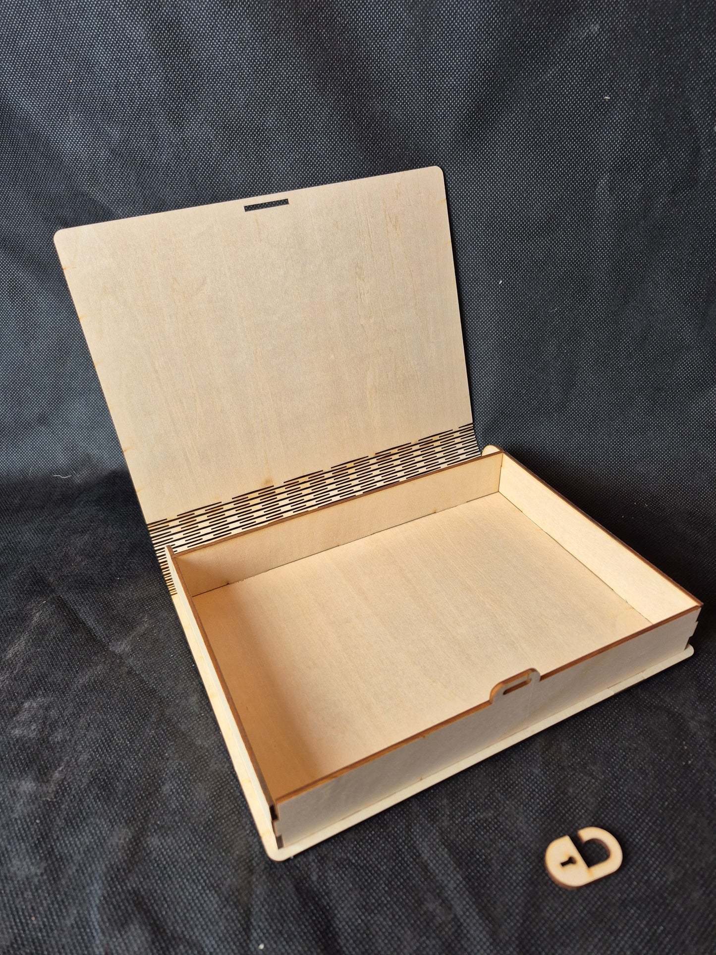 Personalised wooden memorial keepsake box with custom laser engraving on the lid.