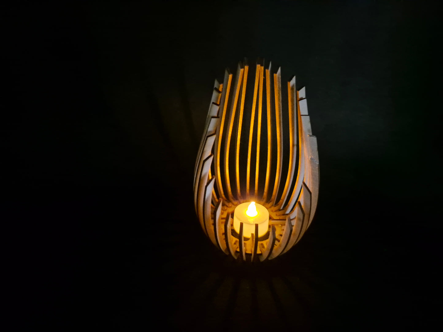 Modern wooden tea light holder with laser cut droplet geometric pattern design