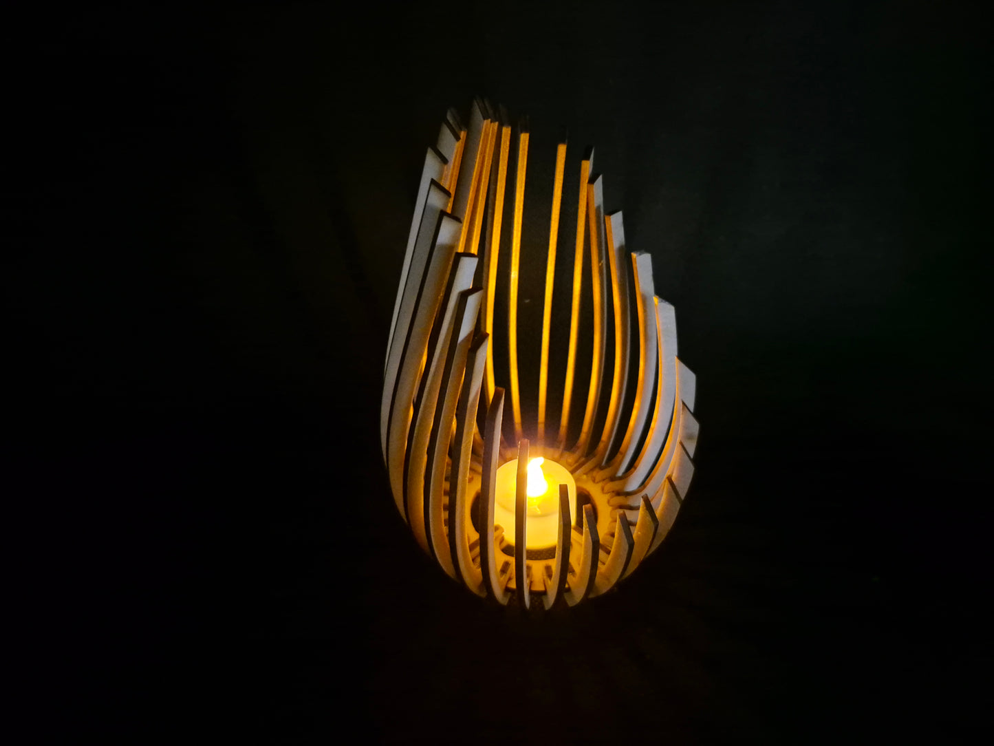 Modern wooden tea light holder with laser cut droplet geometric pattern design