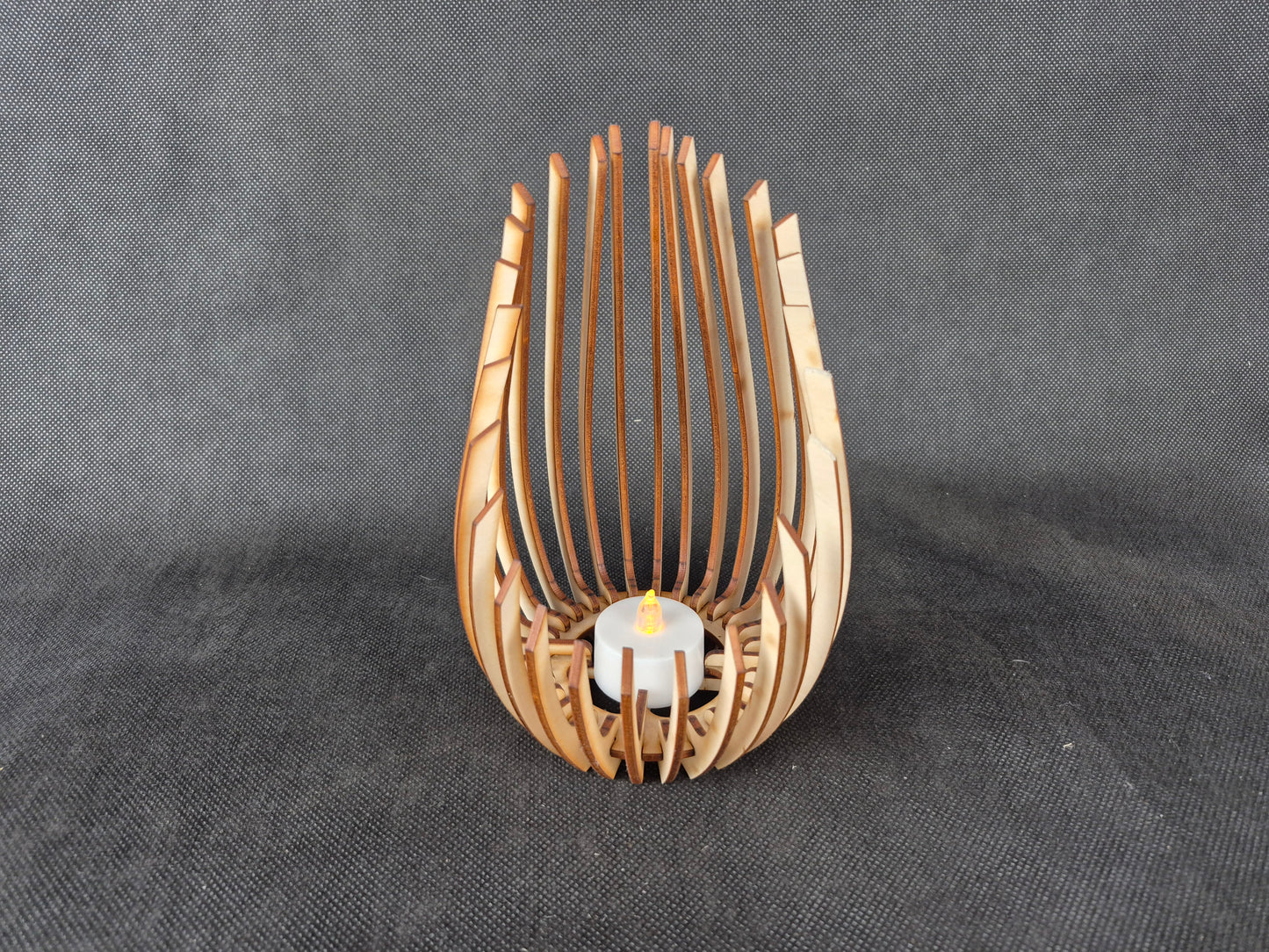 Modern wooden tea light holder with laser cut droplet geometric pattern design