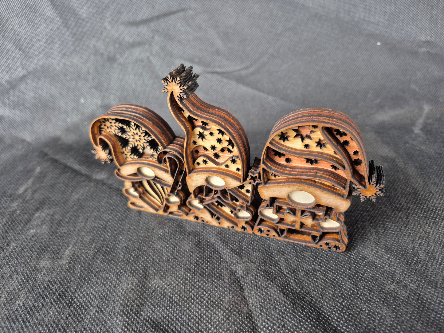 Three-dimensional wooden Nordic Gnome with layered laser cut design and festive details