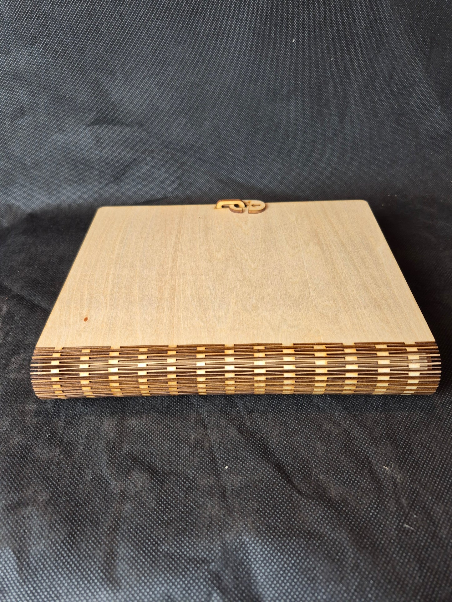 Personalised wooden memorial keepsake box with custom laser engraving on the lid.