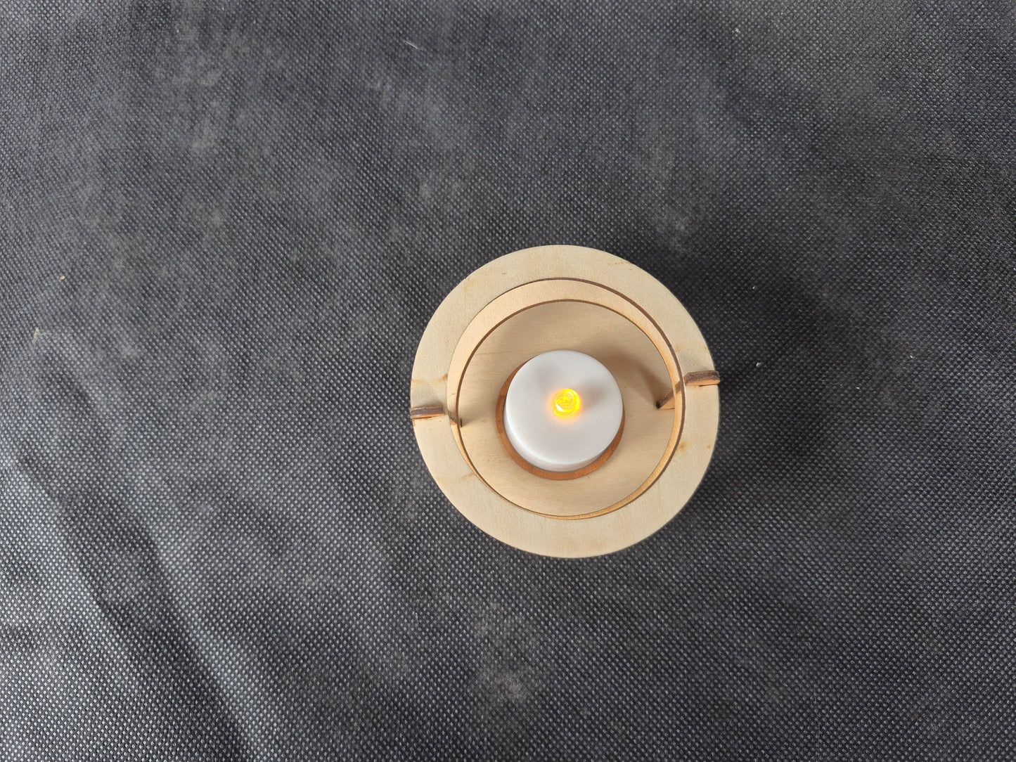 Modern ringed geometric tea light holder with intricate laser cut pattern and ambient lighting