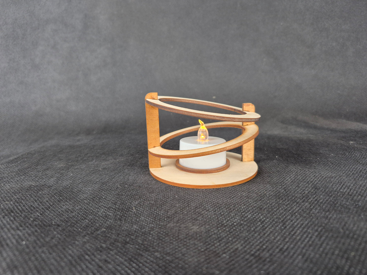 Modern ringed geometric tea light holder with intricate laser cut pattern and ambient lighting