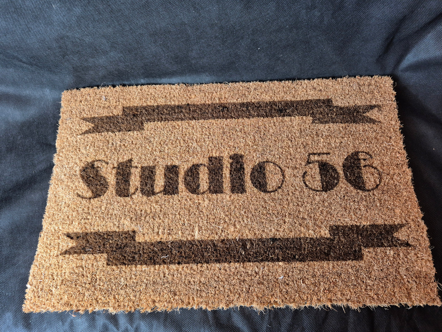 Natural coir door mat with personalized laser design and durable non-slip backing