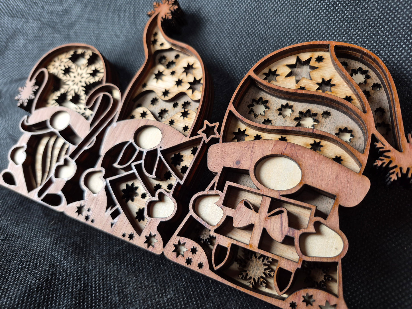 Three-dimensional wooden Nordic Gonk decoration with layered laser cut design and festive details
