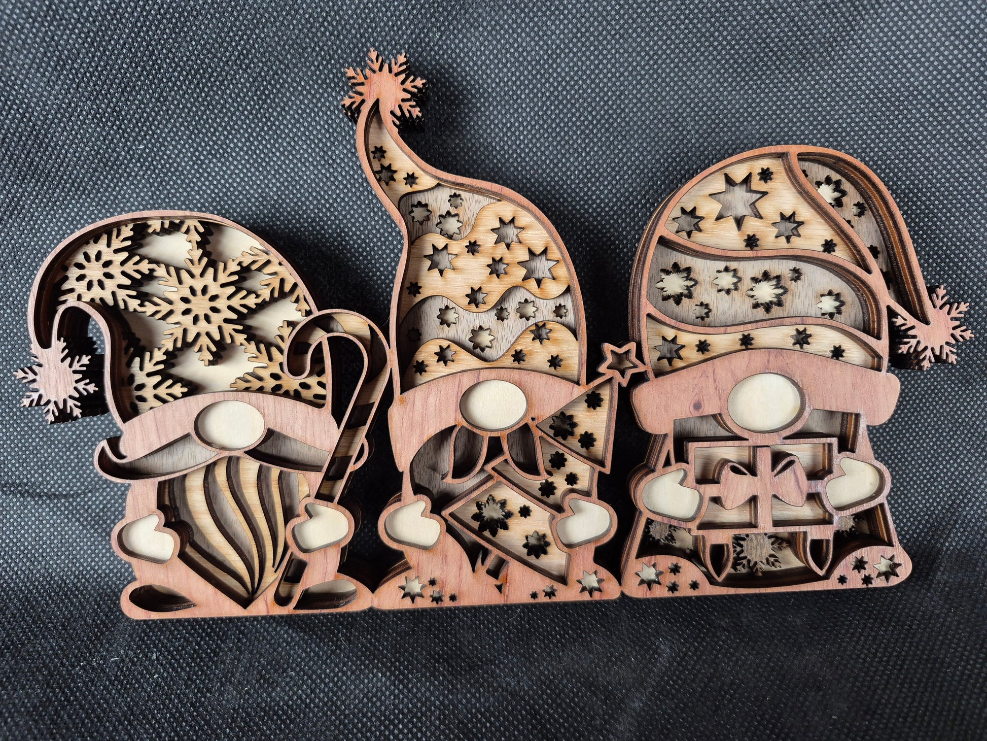 Three-dimensional wooden Nordic Gonk decoration with layered laser cut design and festive details