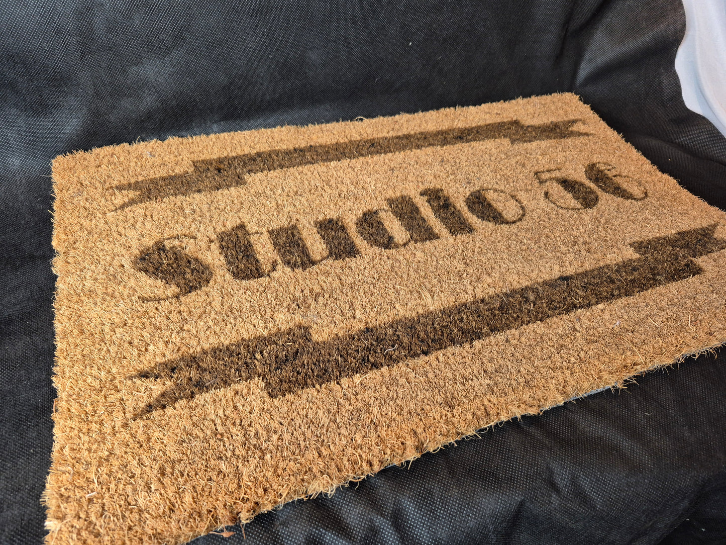 Natural coir door mat with personalized laser design and durable non-slip backing