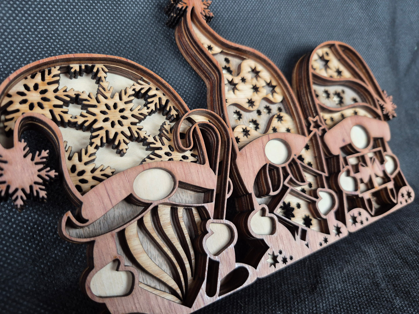 Three-dimensional wooden Nordic Gonk decoration with layered laser cut design and festive details